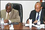 Defence Minister Gen Marcel Gatsinzi and his Ethiopian counterpart Siraj Fegesa signing the agreement