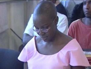 Rwanda's FDU-Inkingi opposition leader Victoire Ingabire in Rwanda's High Court with the shaved head and in prisoner's pink clothes